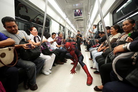 Moises Vazquez, 26, known as Spider-Moy, a computer science teaching assistant at the Faculty of Science of the National Autonomous University of Mexico (UNAM), who teaches dressed as a comic superhero Spider-Man, poses for a photograph on a subway on his way to work in Mexico City, Mexico, May 27, 2016. REUTERS/Edgard Garrido SEARCH "SPIDERMAN TEACHER" FOR THIS STORY. SEARCH "THE WIDER IMAGE" FOR ALL STORIES - RTX2FIF8